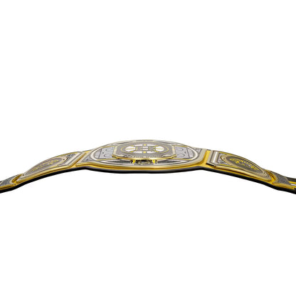 A championship belt with a silver and gold design, featuring a large central plate with a stylized 'H' logo and the words 'HONOR SHAMROCK', flanked by two side plates with circular emblems, set against a plain white background.