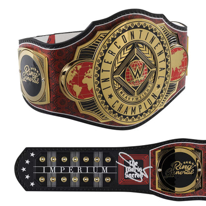 Wrestling championship belt shown from two angles: a large front view and a smaller back view. The belt has a red and black patterned strap with gold-tone metal plates, a central WWE InterContinental Heavyweight Championship plate, a WWE logo, and a smaller Ring of Glory emblem.