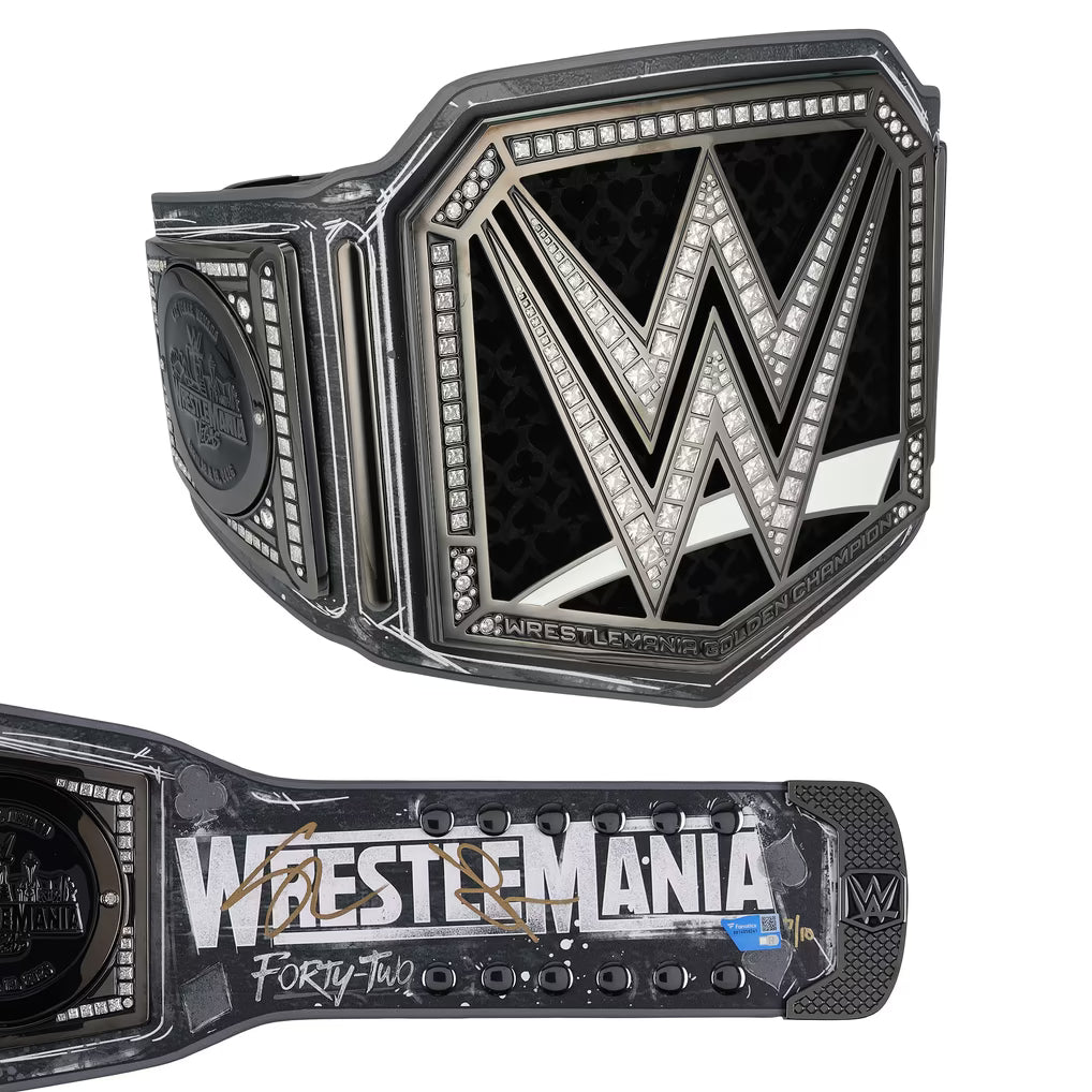 A WrestleMania 42 championship belt shown from two angles on a plain white background. The top view shows the large central WWE-style 'W' emblem with a black textured center and silver-toned border details.