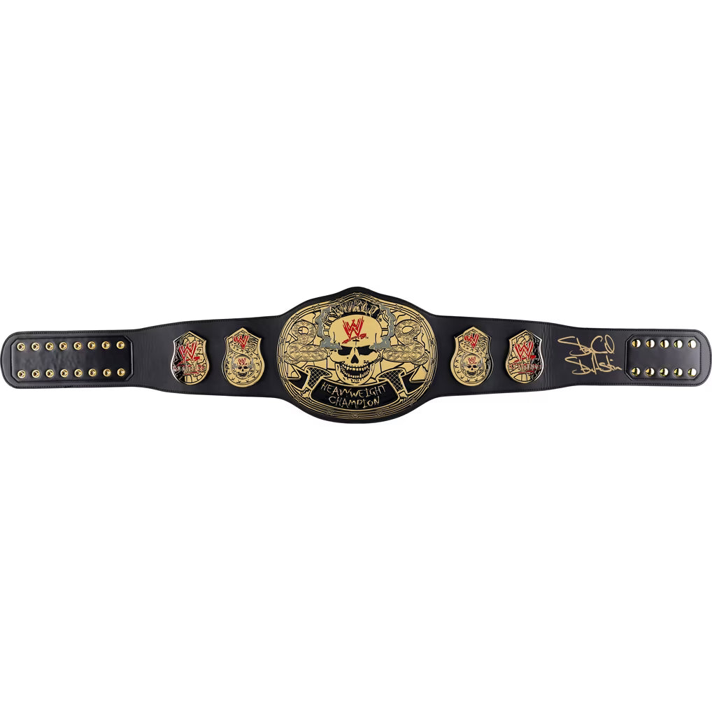 A black championship belt with a large central gold plate featuring a skull and the words 'Cruel It All Championship,' flanked by smaller gold emblems and a signature on the right side, photographed on a plain white background.