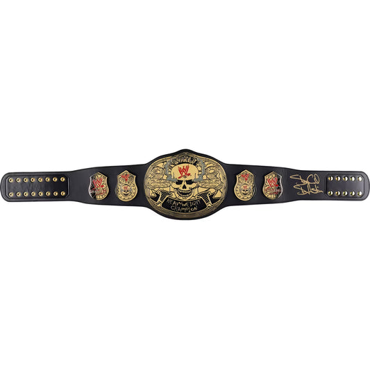 A black championship belt with a large central gold plate featuring a skull and the words 'Cruel It All Championship,' flanked by smaller gold emblems and a signature on the right side, photographed on a plain white background.