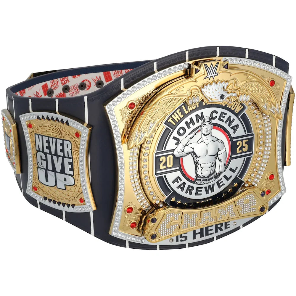 A custom WWE John Cena farewell championship belt with a black strap, gold and silver plates, and rhinestone accents, shown on a plain white background.