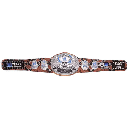 A championship belt with a brown and black snakeskin pattern strap, featuring a large silver central plate with a skull and blue accents, and smaller silver plates with blue and white details on both sides.