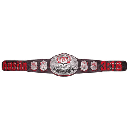 A replica WWE Raw Championship belt featuring a large silver central plaque with a skull and banner, flanked by four smaller silver plates, and red-and-black leather straps with silver studs and the word 'RAW' on both ends.
