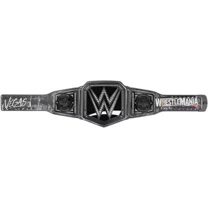 WrestleMania Las Vegas Championship belt featuring a black and silver design with the WWE logo in the center, 'WrestleMania' text on the right, and 'Las Vegas' on the left, shown against a plain white background.