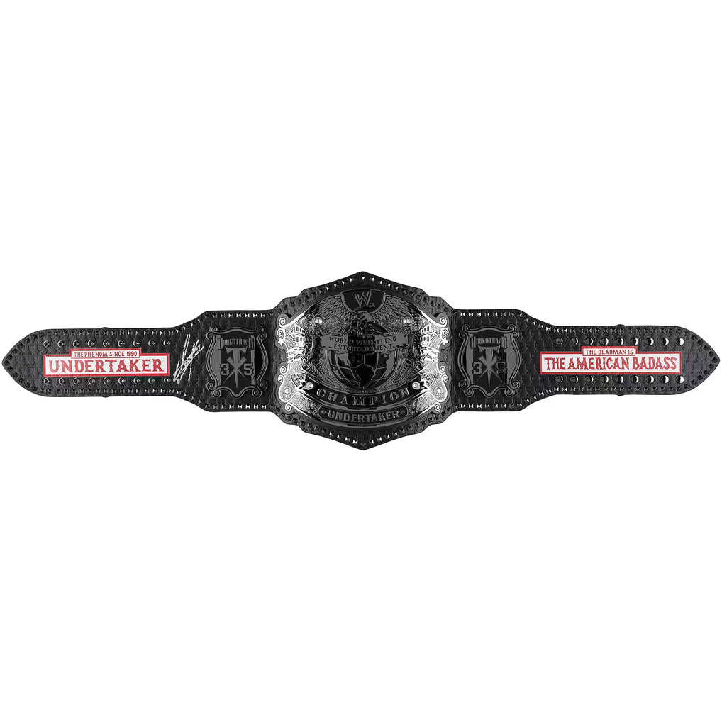 A black and silver WWE Championship belt with red and white text, displayed horizontally against a plain white background.