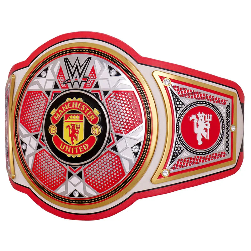 A replica of the WWE Manchester United Championship belt, featuring a red, white, and gold design with the Manchester United club crest in the center and the WWE logo at the top.