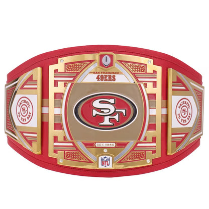 A San Francisco 49ers championship belt featuring a large central gold and red plate with the '49ers' logo, flanked by two side plates with NFL shield logos and team insignia, all on a red and gold leather-and-metal structure against a white background.