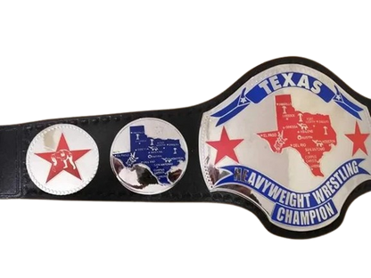 A novelty Texas Heavyweight Wrestling Champion belt featuring a large silver and white main plate with a red and blue map of Texas, flanked by two smaller circular plates on a black strap.