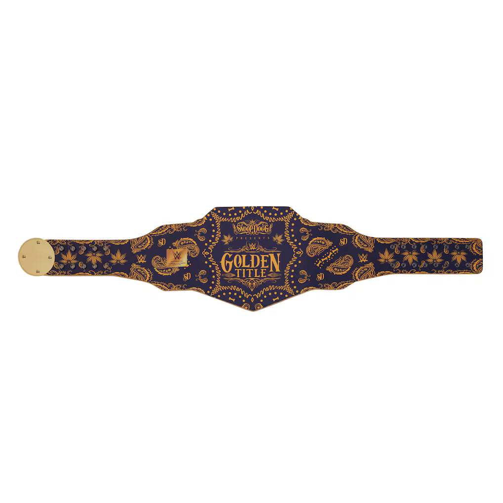 A championship belt with a navy blue and gold paisley bandana pattern, featuring a central shield-shaped plate with 'GOLDEN TITLE' printed in gold, and gold-toned metal hardware on a white background.