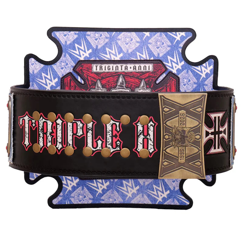 A WWE Temple Taurus championship belt replica displayed on a branded blue and white WWE stand. The belt is black with red and white lettering, gold studs, and a gold buckle featuring the year 2025.