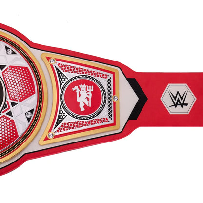 A close-up of a WWE championship belt featuring a red and white design with gold trim, a central circular plate with a devil logo, and a WWE logo on the strap, set against a plain white background.