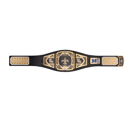 A black and gold championship belt with multiple plates, featuring a central fleur-de-lis emblem and a blue 'N' logo on one side, displayed flat against a white background.