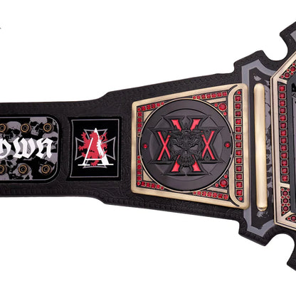 Black championship belt with red and gold accents on a white background