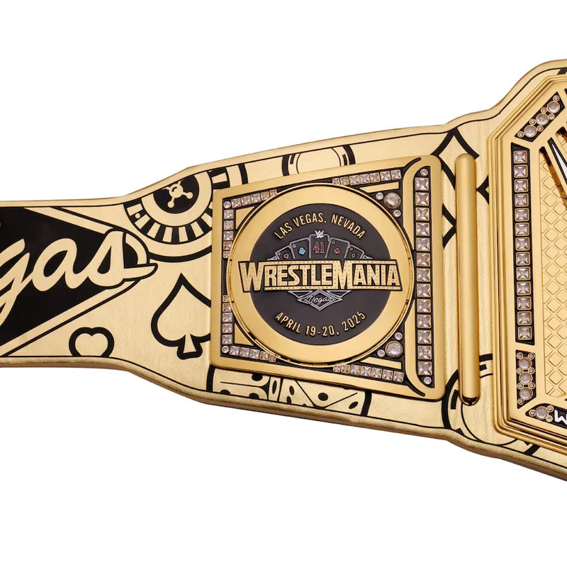 Gold wrestling championship belt with 'WrestleMania' text on a white background