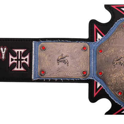 Close-up of a decorative belt with intricate patterns and red stones on a white background