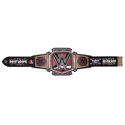 A WWE Raw Championship belt replica displayed horizontally against a solid white background. The belt features a black base with red and gold accents, the central WWE logo, and 'RAW' text on both ends.