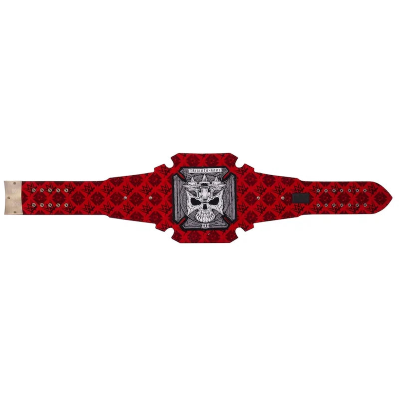 A red and black patterned belt with a central silver and black skull emblem, displayed flat against a white background.