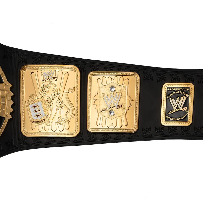 A close-up of a WWE championship belt featuring three ornate gold-tone plates on a black textured strap, with the WWE logo and 'Property of WWE' visible on the right plate.