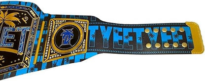 A WWE 'Tye Tyler' Championship belt replica with a black, blue, and gold tropical palm tree design, shown on a plain white background.